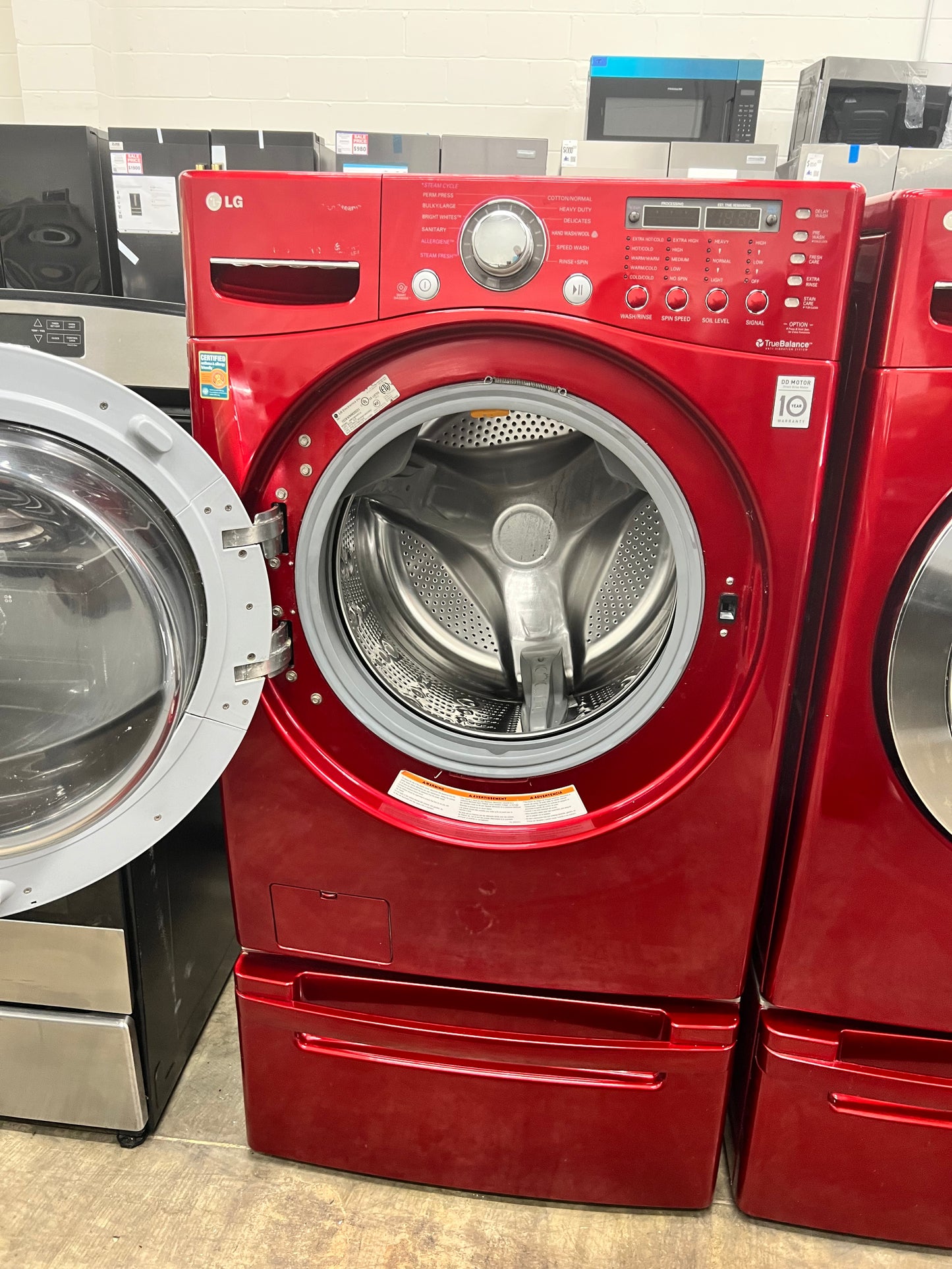 LG Front-Load 3.9 Cu. Ft. Washer and 7.4 Cu. Ft. Electric Dryer Set in Wild Cherry Red with Pedestals