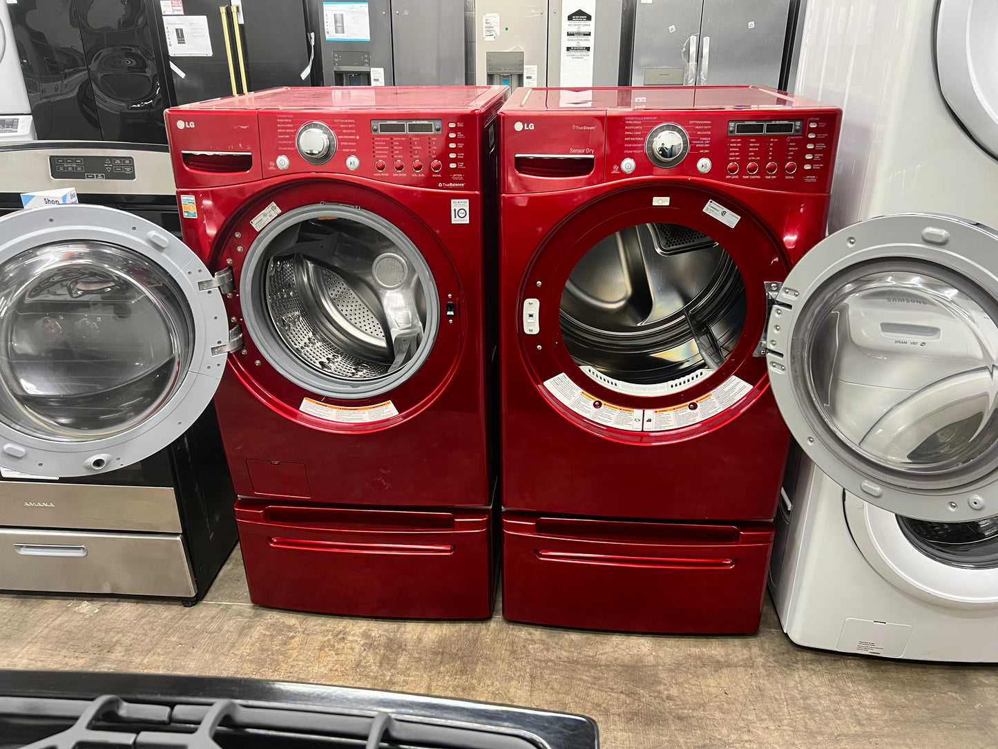 LG Front-Load 3.9 Cu. Ft. Washer and 7.4 Cu. Ft. Electric Dryer Set in Wild Cherry Red with Pedestals