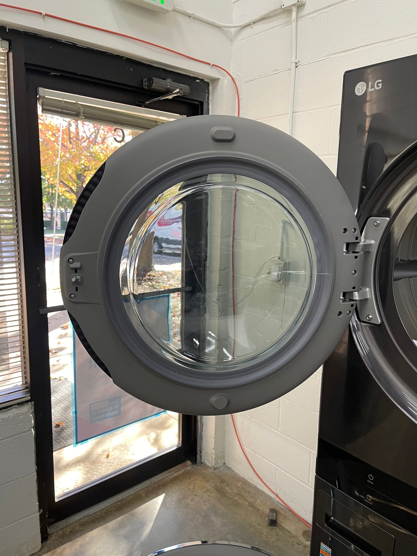 LG WashTower Stacked SMART Laundry Center 4.5 Cu.Ft. Front Load Washer & 7.4 Cu.Ft. Electric Dryer in Black Steel w/ Steam - Used