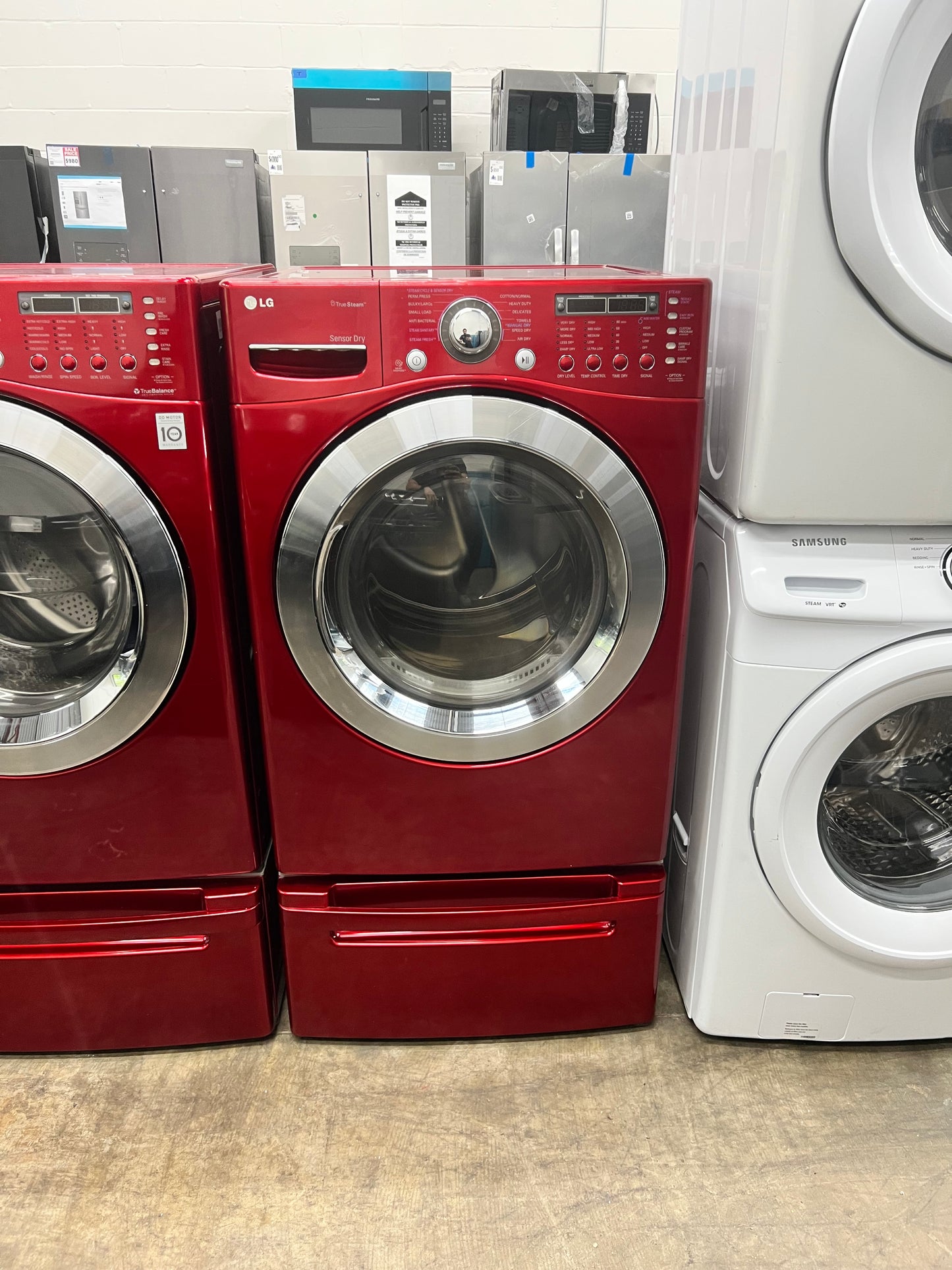 LG Front-Load 3.9 Cu. Ft. Washer and 7.4 Cu. Ft. Electric Dryer Set in Wild Cherry Red with Pedestals