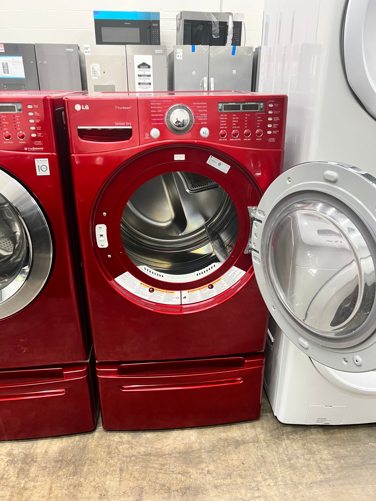 LG Front-Load 3.9 Cu. Ft. Washer and 7.4 Cu. Ft. Electric Dryer Set in Wild Cherry Red with Pedestals