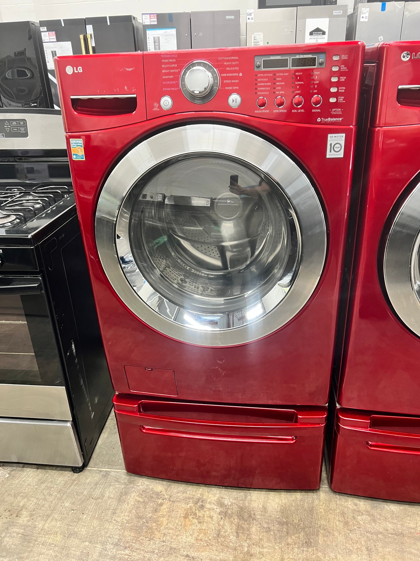 LG Front-Load 3.9 Cu. Ft. Washer and 7.4 Cu. Ft. Electric Dryer Set in Wild Cherry Red with Pedestals