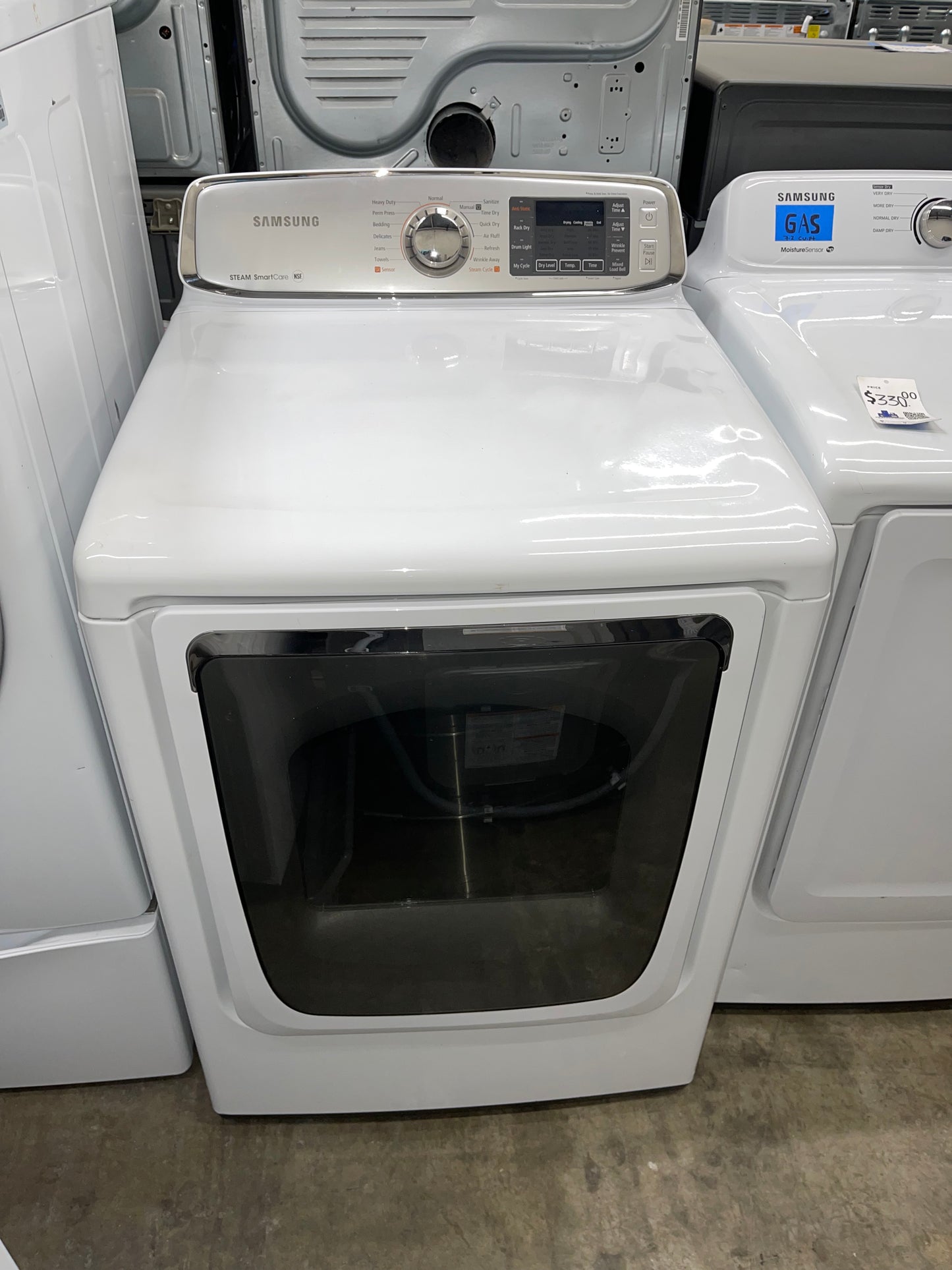 Samsung  DV50F9A6EVW
27 Inch Electric Dryer with 7.4 cu. ft. Capacity, 13 Drying Cycles, Dryer Rack, Smart Care, LED Controls, Stainless Steel Drum, Reversible Door, Wrinkle Away and Steam