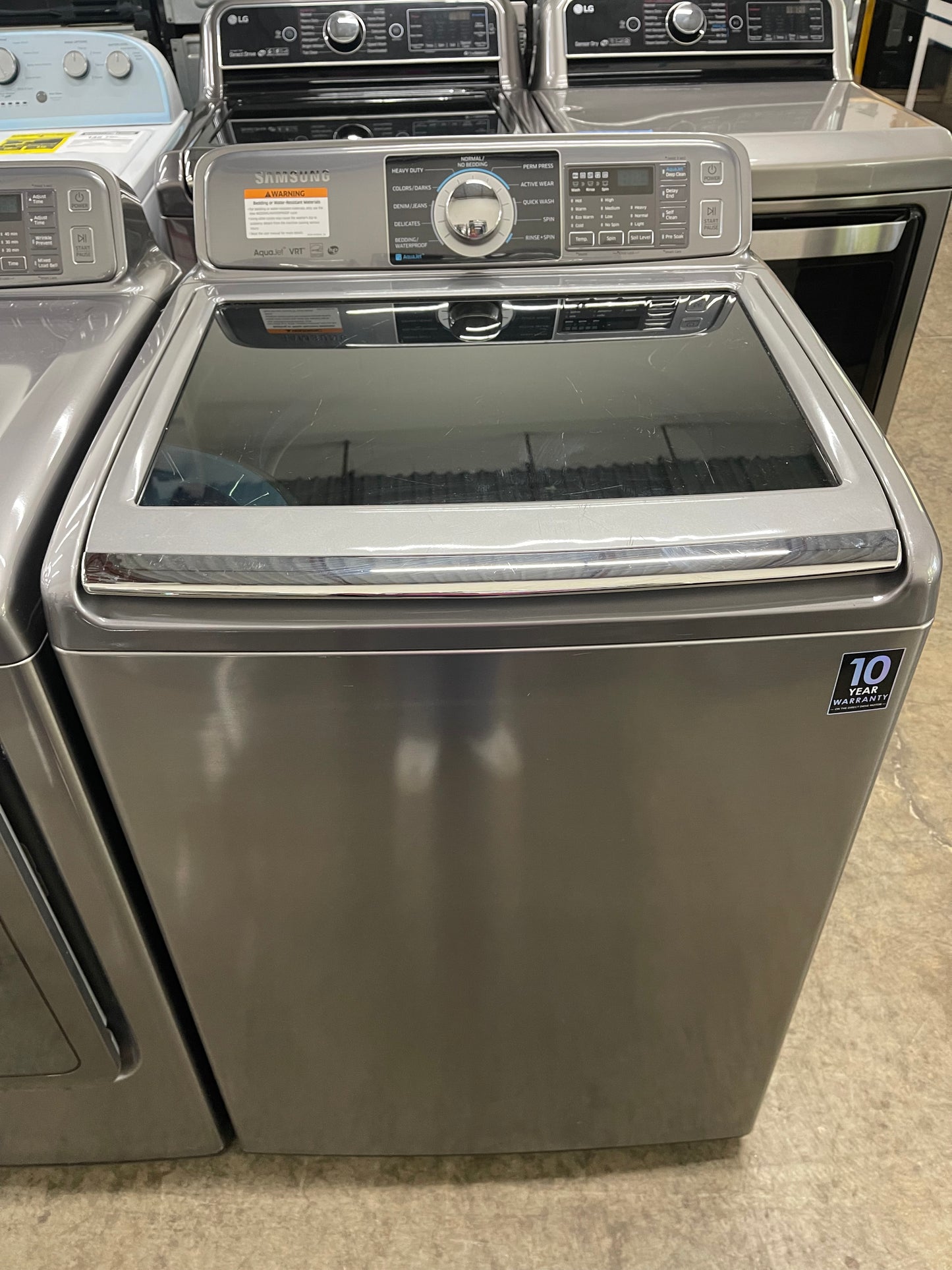 Samsung  WA48H7400AP
27 Inch 4.8 cu. ft. Top Load Washer with 11 Wash Cycles and Samsung  DV48H7400EP
27 Inch 7.4 cu. ft. Electric Dryer with 11 Dry Cycles,