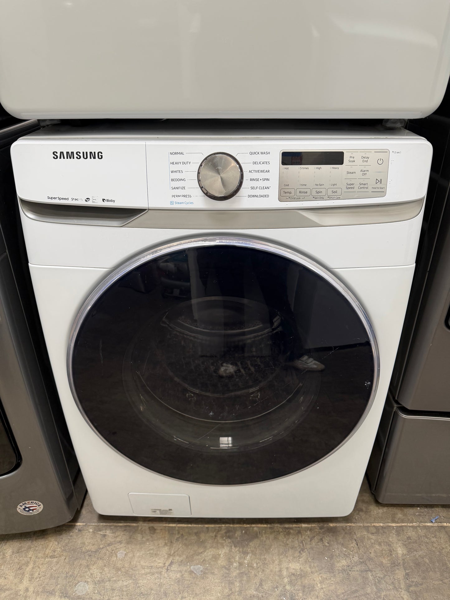 Samsung  WF45R6300AW
27 Inch Front Load Smart Washer with 4.5 Cu. Ft. And Samsung  DVE45R6300W
27 Inch Electric Smart Dryer with 7.5 cu. ft.