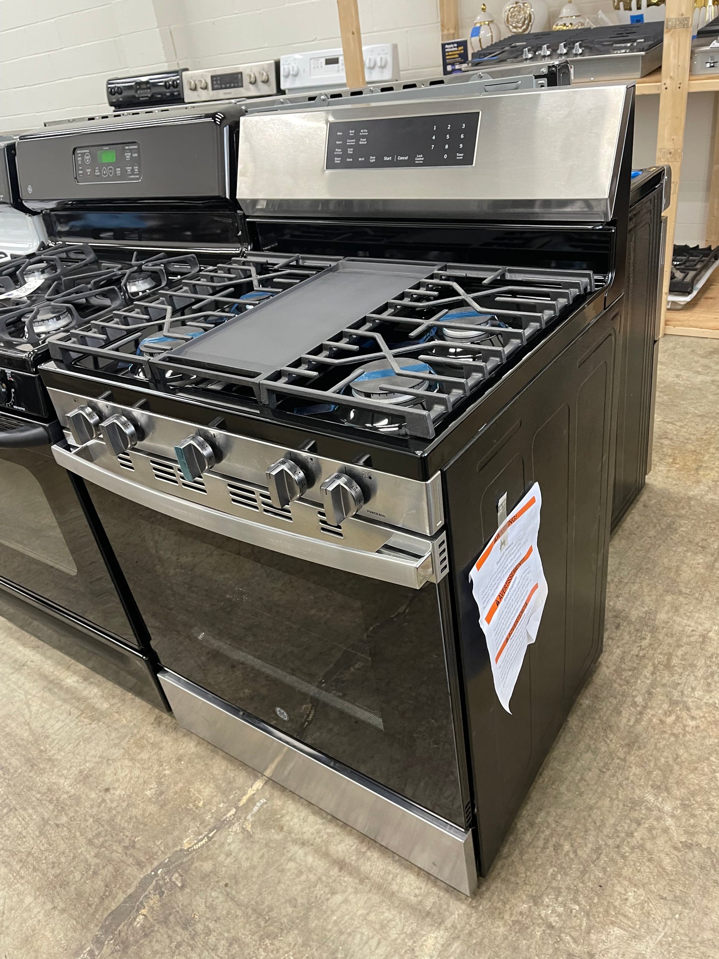 GE  GGF600AVSS
30 Inch Freestanding Gas Smart Range with 5 Sealed Burners, 5.3 cu. ft. Convection Oven, Power Boil Burner, Griddle, Storage Drawer, WiFi, Enhanced Shabbos Mode Built In, and Steam Clean: Stainless Steel