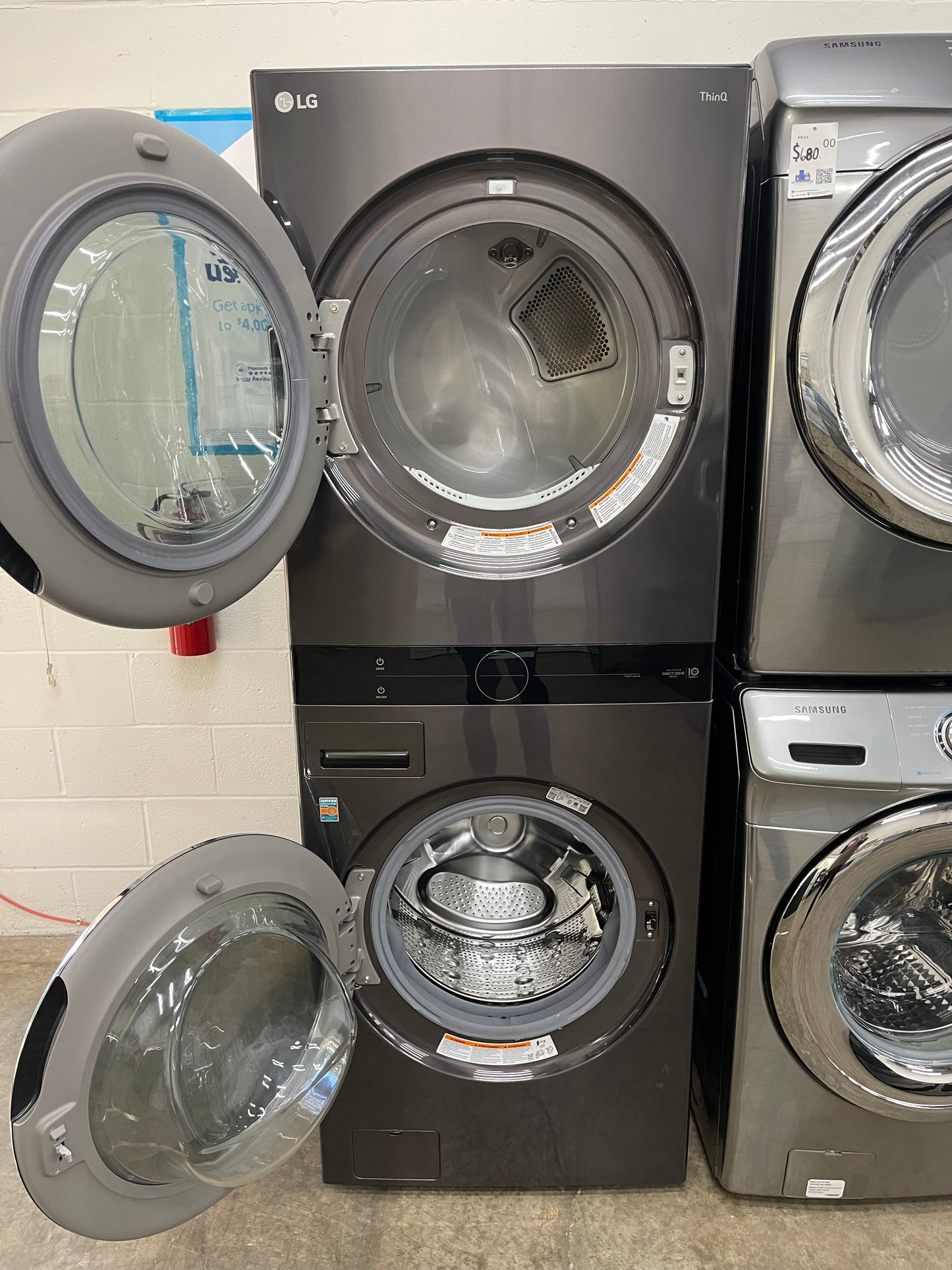 LG WashTower Stacked SMART Laundry Center 4.5 Cu.Ft. Front Load Washer & 7.4 Cu.Ft. Electric Dryer in Black Steel w/ Steam - Used