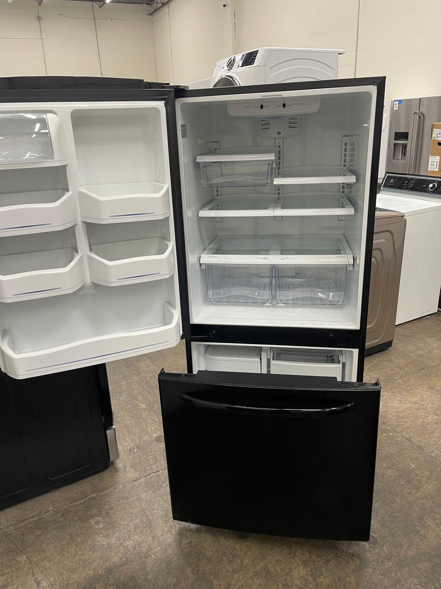 GE  GDSC0KCXBB
20.2 cu. ft. Bottom-Freezer Refrigerator with 4 Glass Shelves, Gallon Door Storage, Snack Drawer and Illuminated Upfront Temperature Controls: Black