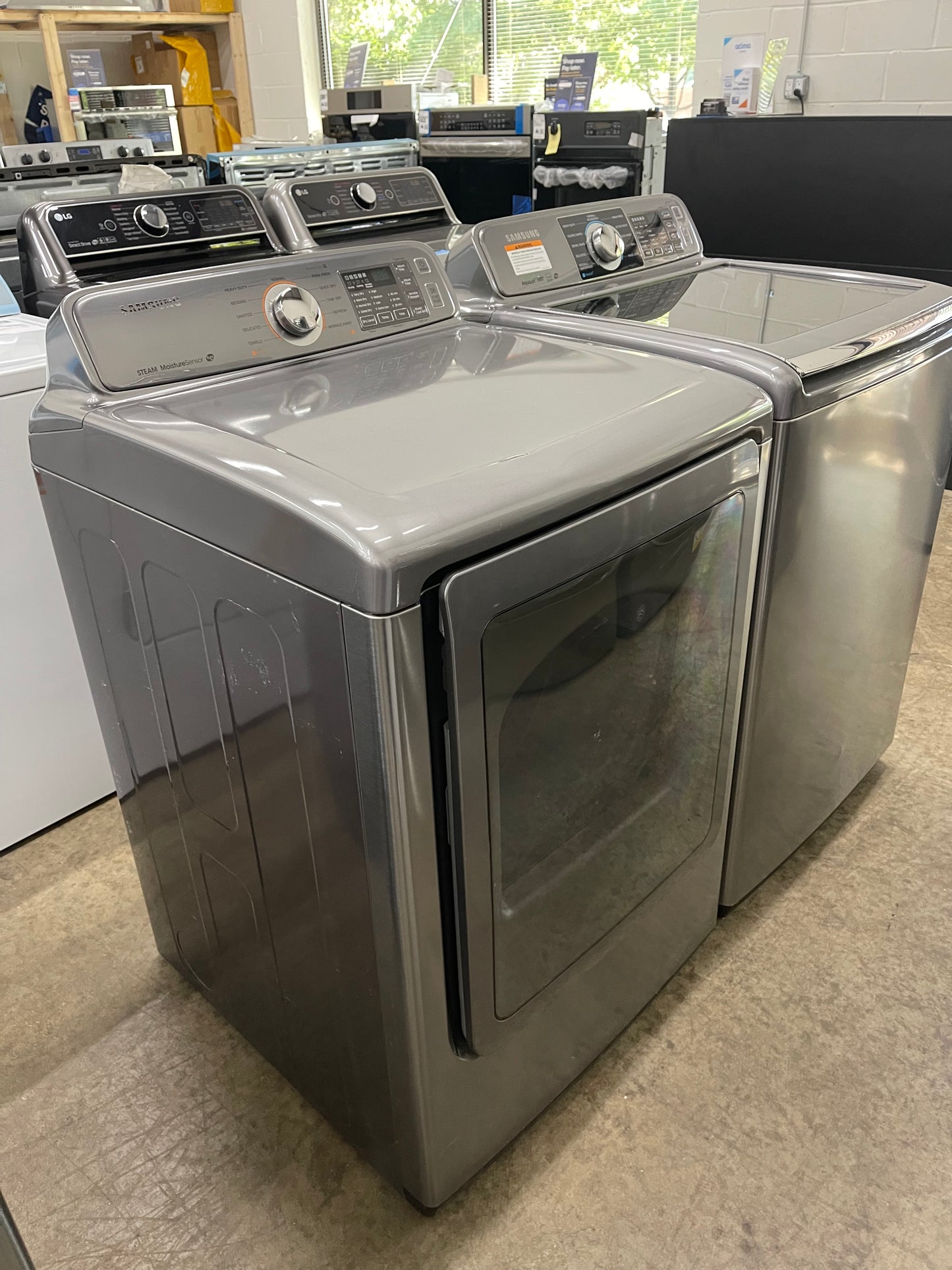 Samsung  WA48H7400AP
27 Inch 4.8 cu. ft. Top Load Washer with 11 Wash Cycles and Samsung  DV48H7400EP
27 Inch 7.4 cu. ft. Electric Dryer with 11 Dry Cycles,