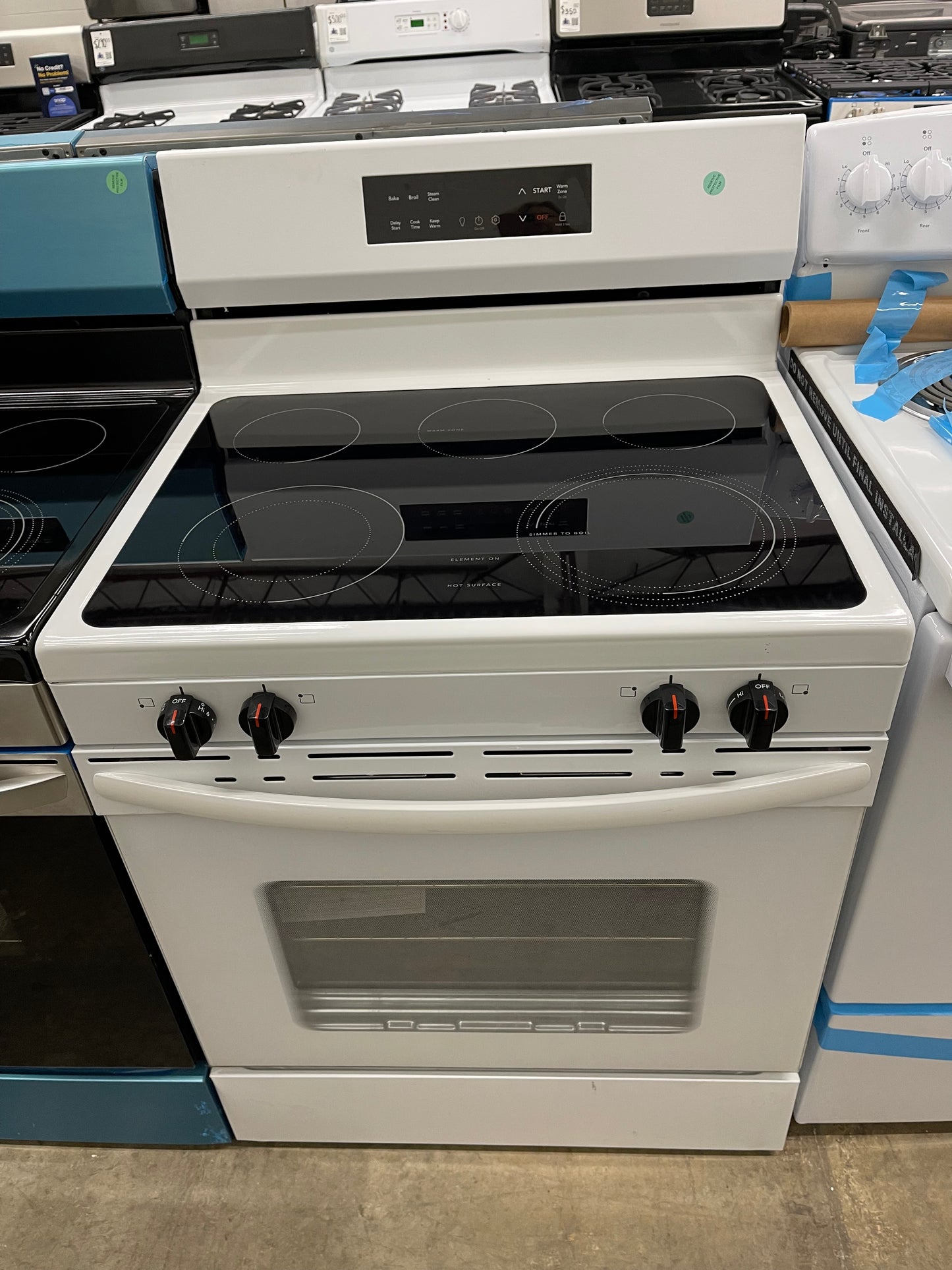 Frigidaire  FCRE3062AW
30 Inch Freestanding Electric Range with 5 Elements, 5.3 cu. ft. Capacity, EvenTemp Element, SpaceWise Element, Storage Drawer, and Steam Clean: White