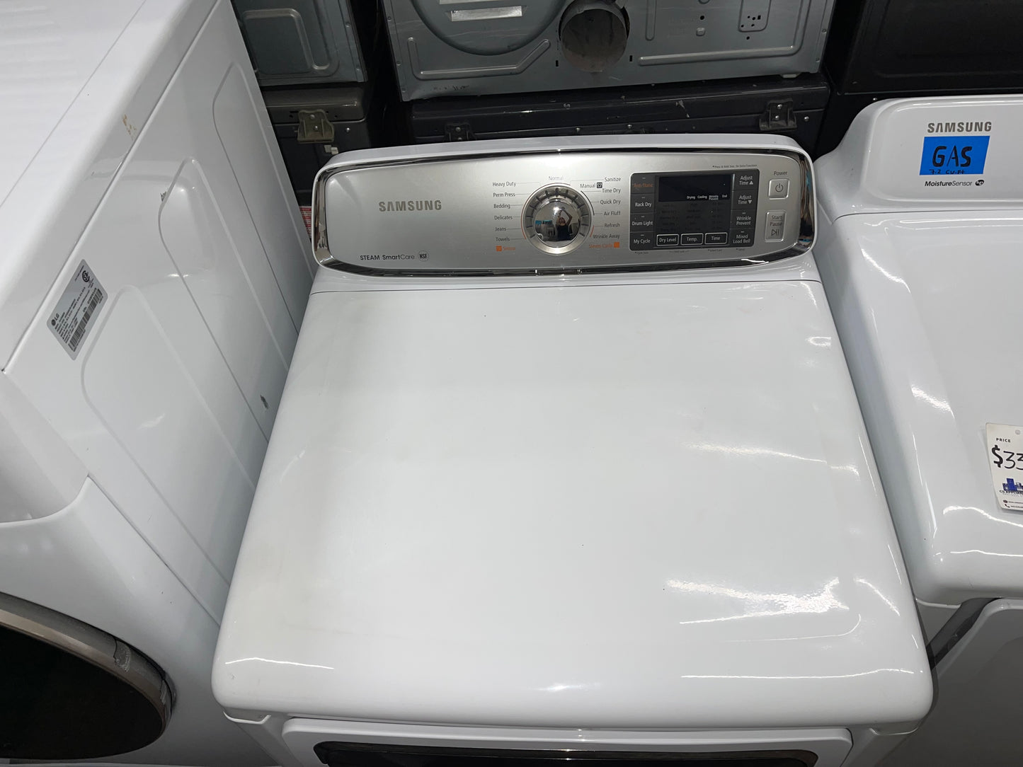 Samsung  DV50F9A6EVW
27 Inch Electric Dryer with 7.4 cu. ft. Capacity, 13 Drying Cycles, Dryer Rack, Smart Care, LED Controls, Stainless Steel Drum, Reversible Door, Wrinkle Away and Steam