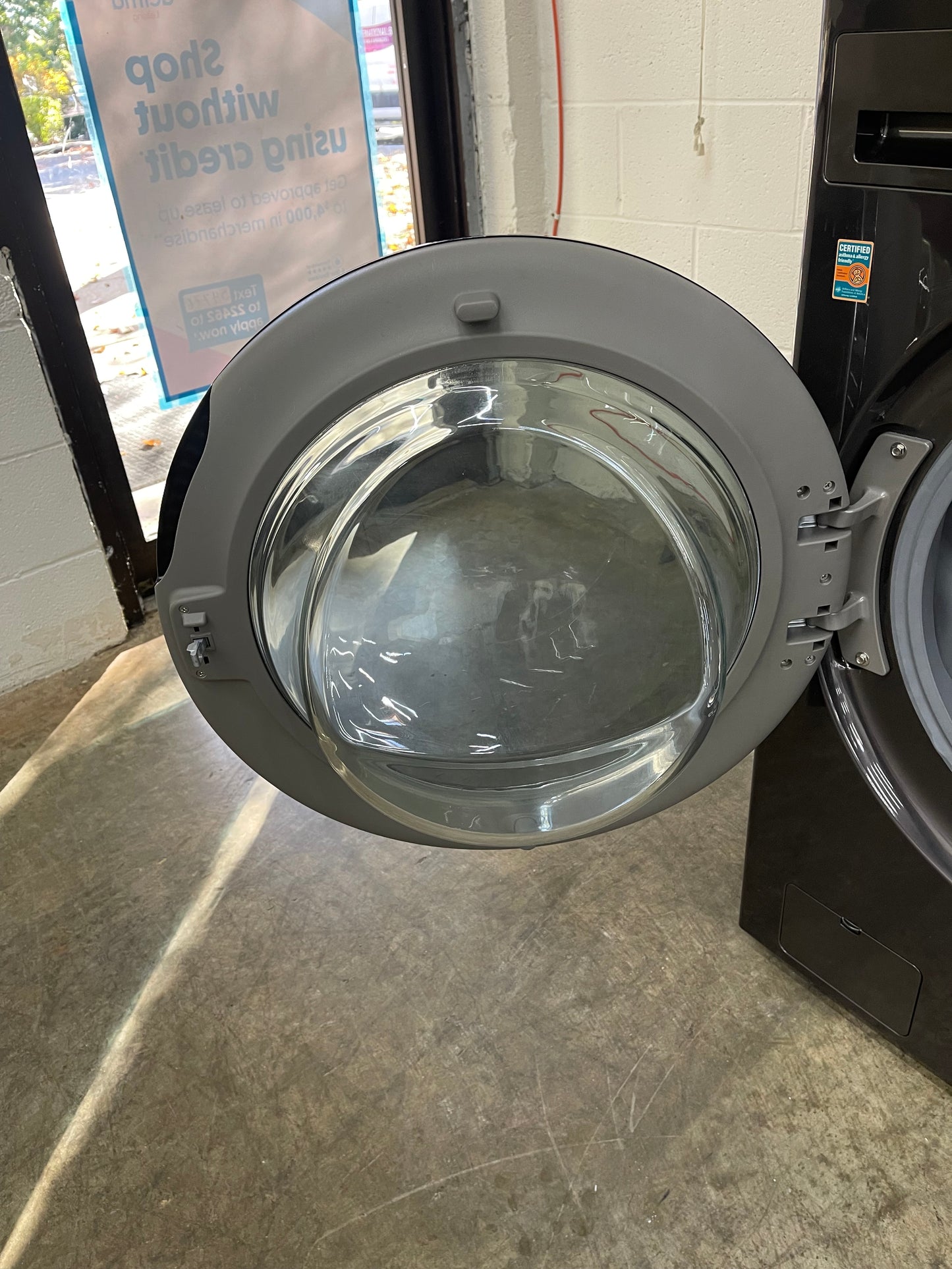 LG WashTower Stacked SMART Laundry Center 4.5 Cu.Ft. Front Load Washer & 7.4 Cu.Ft. Electric Dryer in Black Steel w/ Steam - Used