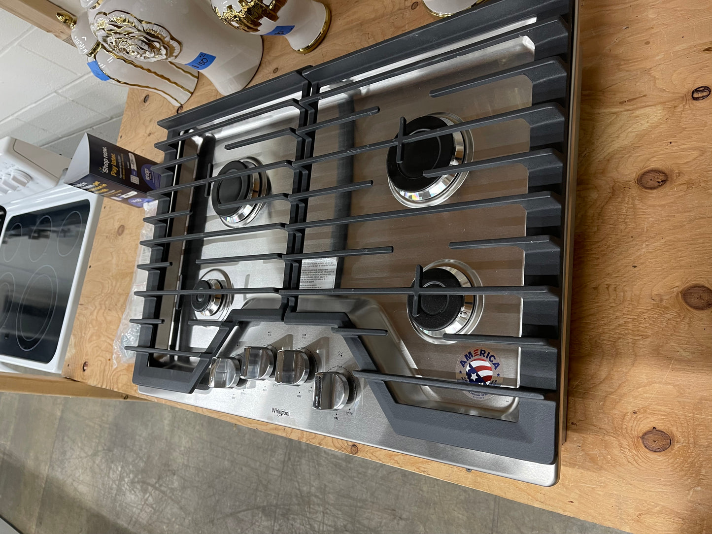 Whirlpool  WCG55US0HS
30 Inch Gas Cooktop with 4 Sealed Burners, EZ-2-Lift Hinged Grates, SpeedHeat Burner, AccuSimmer Burner, Upswept SpillGuard Cooktop, and Dishwasher-Safe Knobs: Stainless Steel